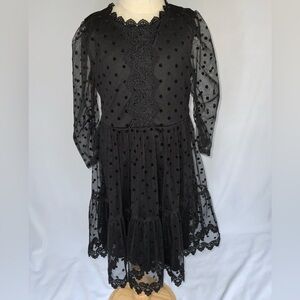 NWOT Rare Editions SZ 6X stylish black dress with sheer overlay and lace detail.